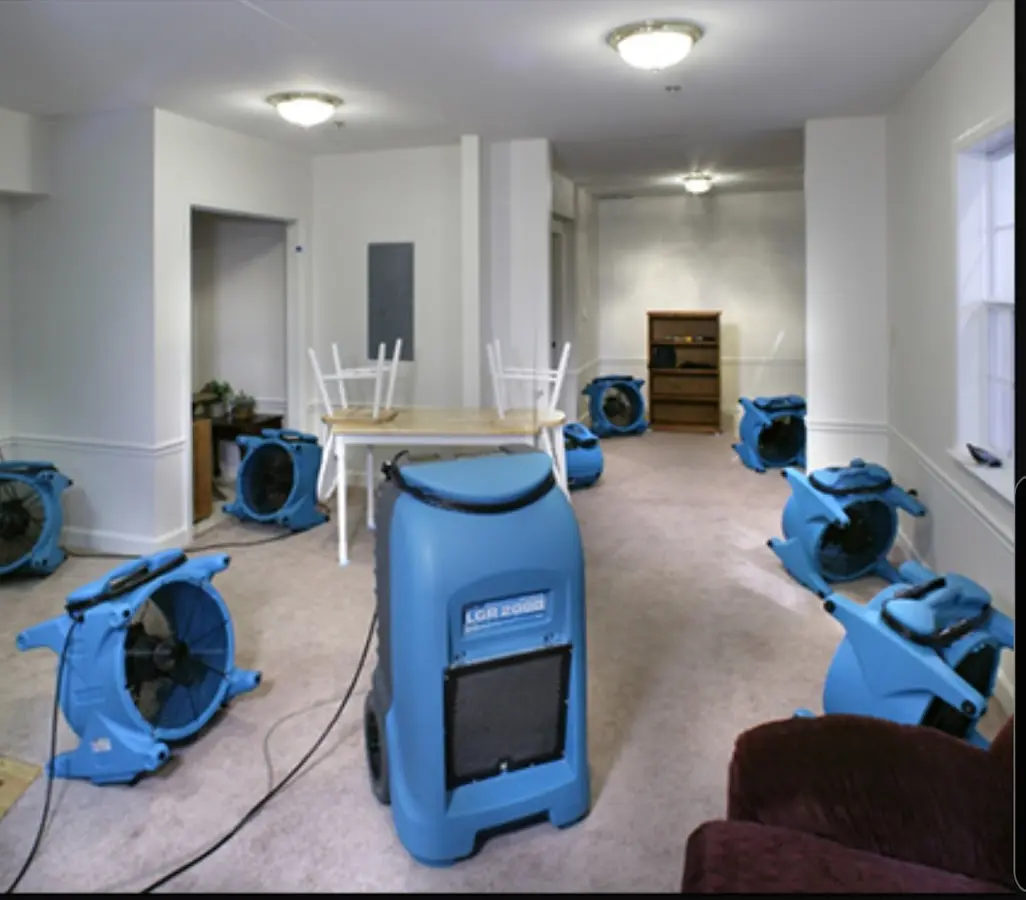 Air movers and dehumidifier setup for Water Damage Restoration in Hammond